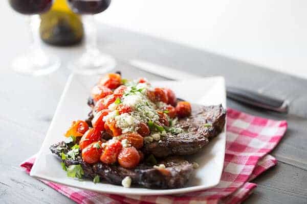 Roasted tomatoes steal the show in this simple grilled sirloin steak recipe. lemonsforlulu.com