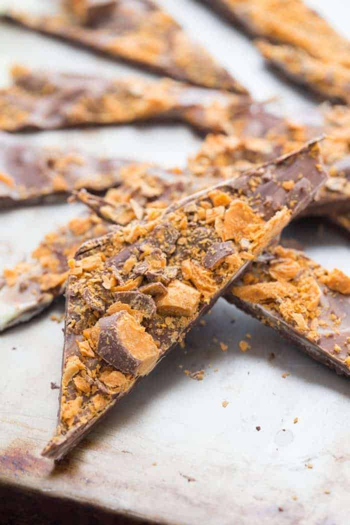 Chocolate bark candy make with white and semi sweet chocolate and lots of Butterfinger candies!