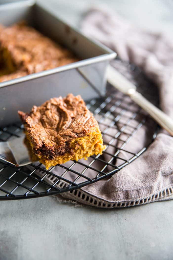 pumpkin bars recipe pan and square on a baking rack