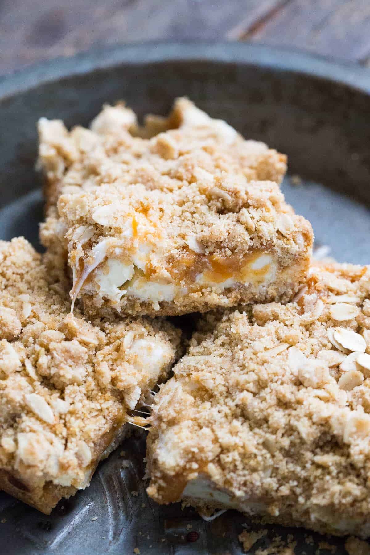 Caramel bars that have a caramel and peanut butter filling resting atop white chocolate chips. This combo is so amazing!