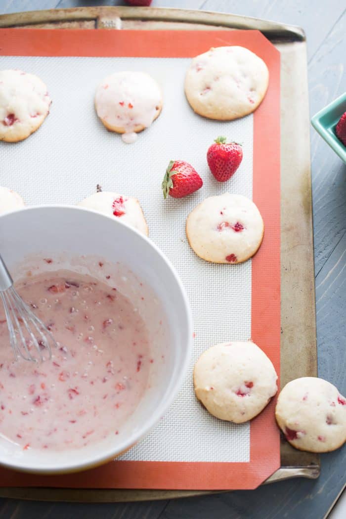 Ricotta cookies are soften tender little sweets. Each cookie is packed with chopped fresh strawberries in the cookie and in the silky glaze on top!