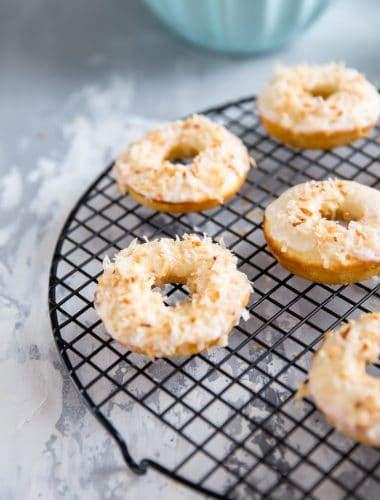 toasted coconut baked donut recipe on a wire rack