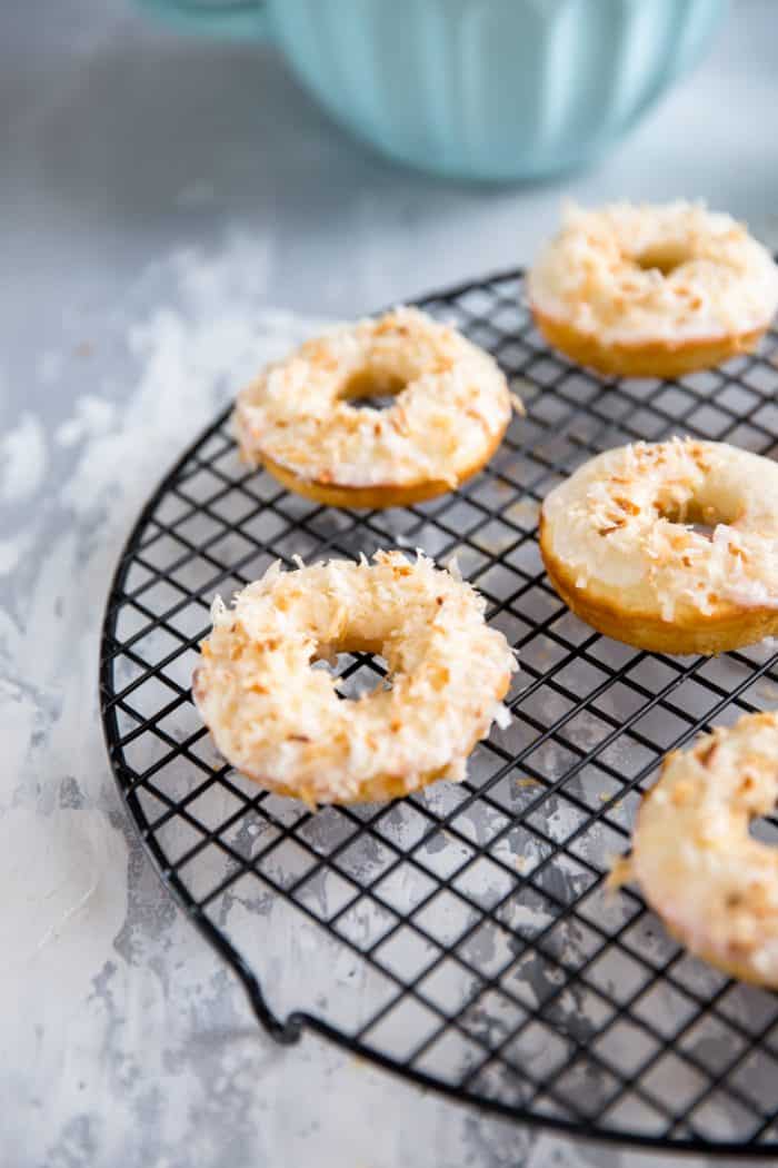 toasted coconut baked donut recipe on a wire rack