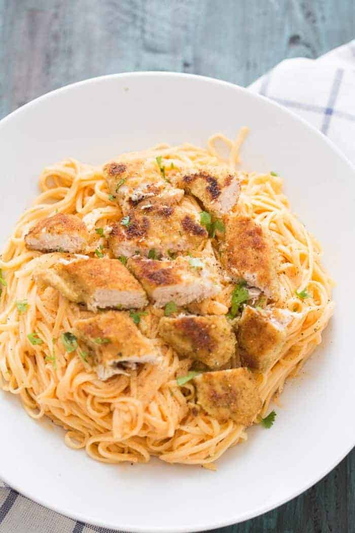 Chicken fettuccine alfredo like you've never tasted! Pasta noodles are coated with a light and creamy buffalo flavored alfredo sauce then topped with seasoned baked chicken!