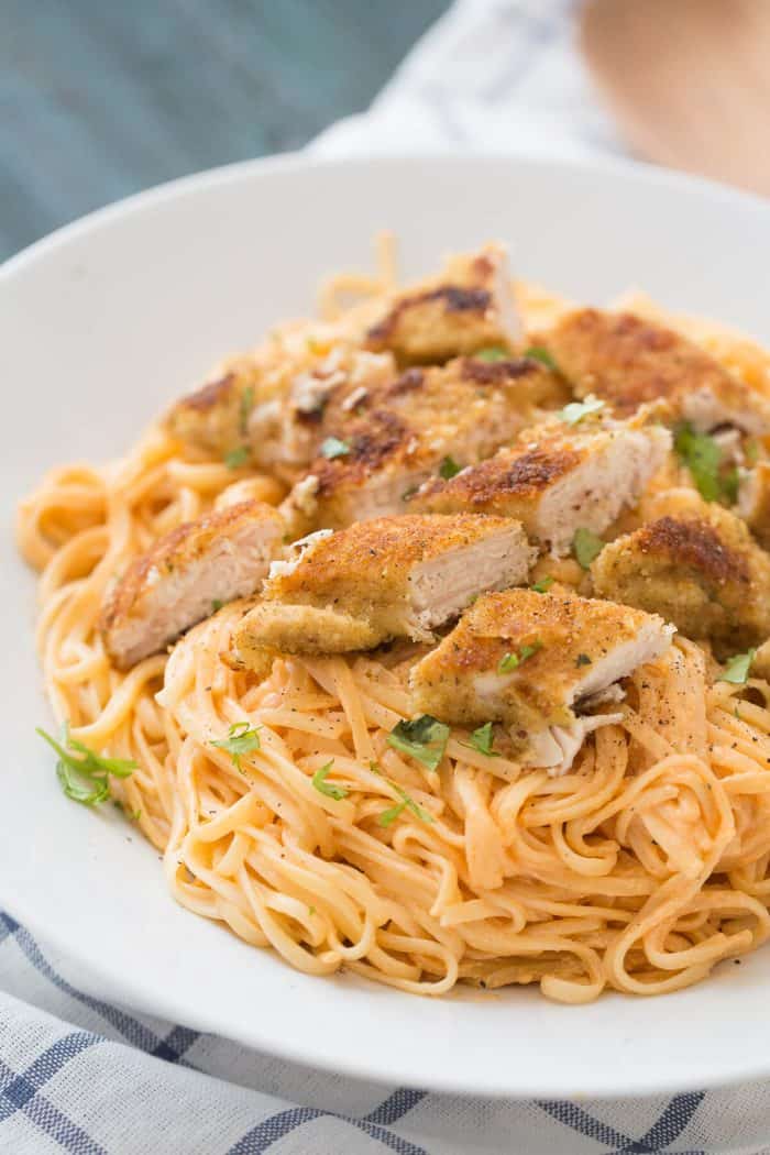Chicken fettuccine alfredo like you've never tasted! Pasta noodles are coated with a light and creamy buffalo flavored alfredo sauce then topped with seasoned baked chicken