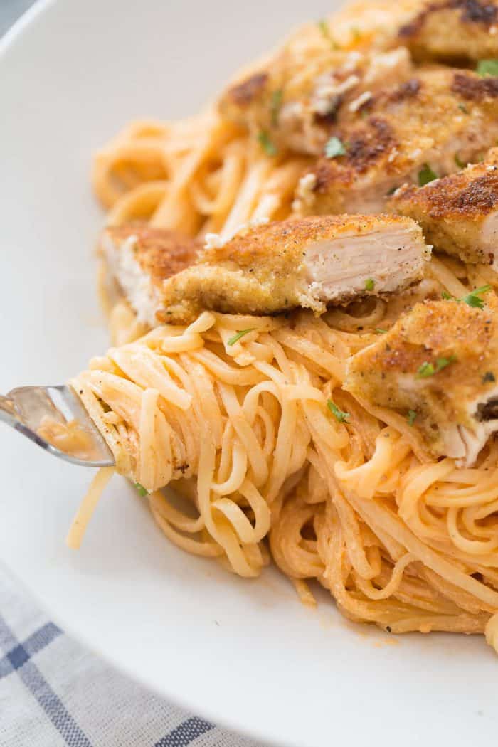 Chicken fettuccine alfredo like you've never tasted! Pasta noodles are coated with a light and creamy buffalo flavored alfredo sauce then topped with seasoned baked chicken