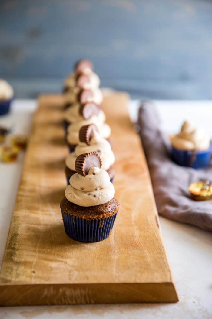 Chocolate cupcakes with peanut butter frosting in a row