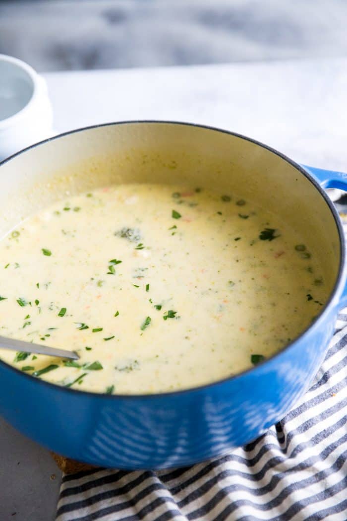 broccoli cheese soup in a blue pot
