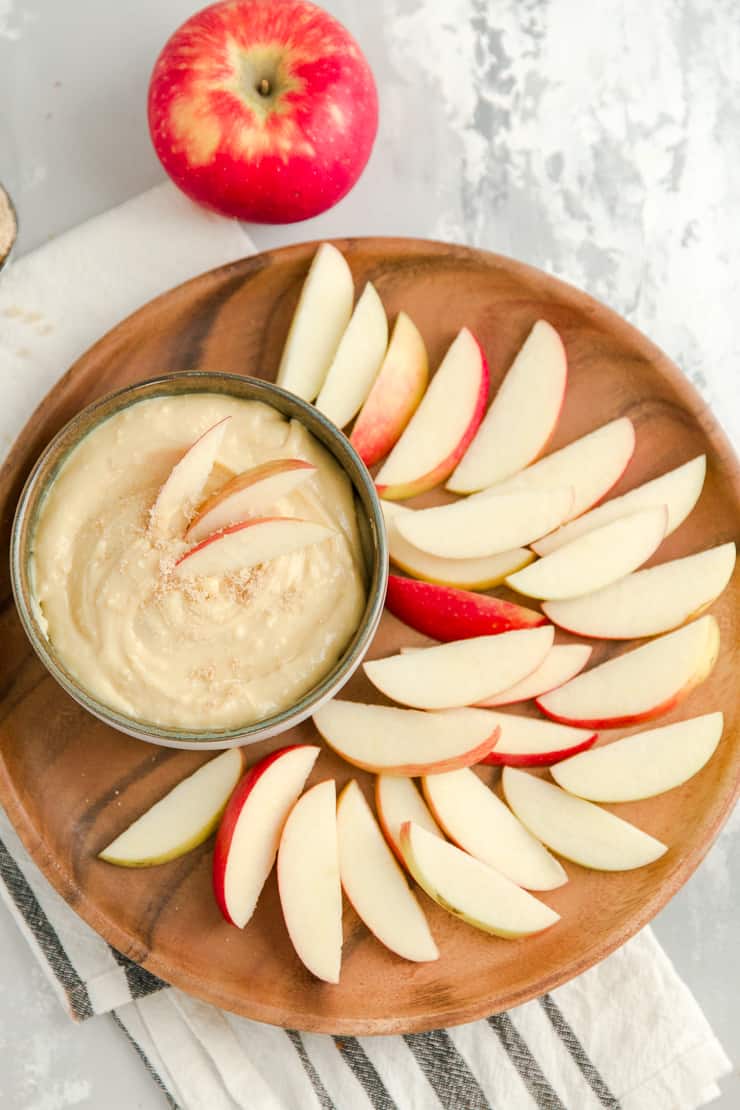 caramel apple dip surrounded by apple slices
