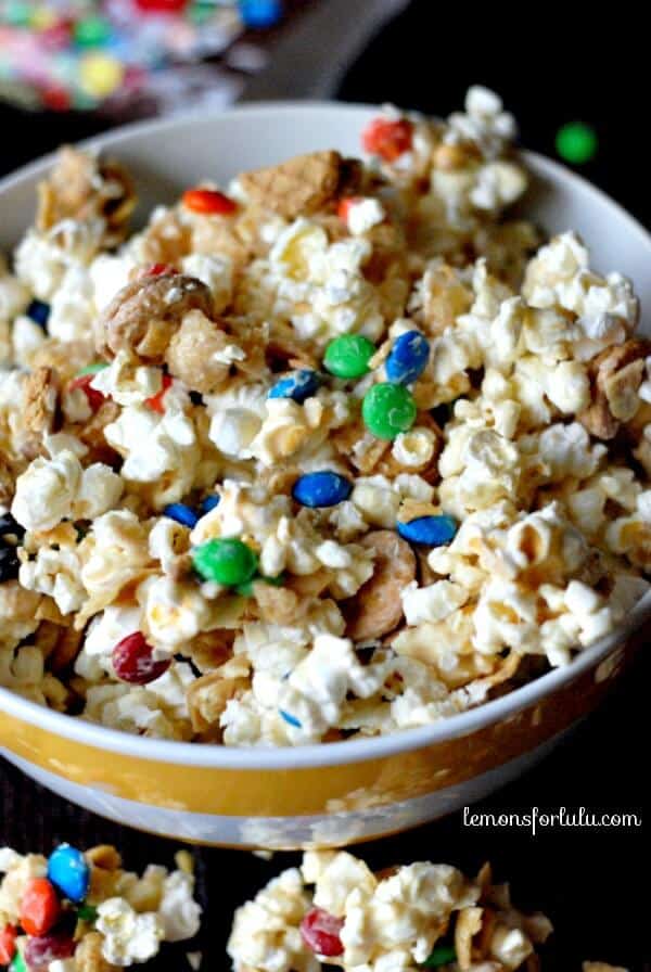 M & M’s with popcorn, corn chips, peanut butter cookies all with a white chocolate coating! www.lemonsforlulu.com #shop