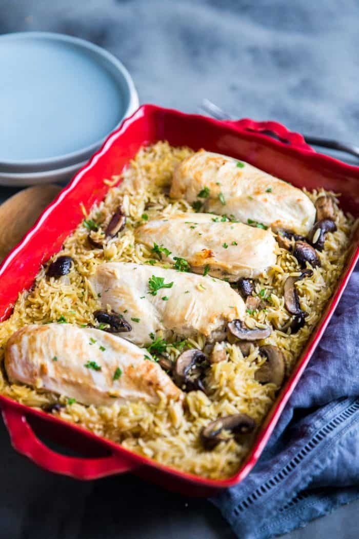 Baked chicken in red baking dish