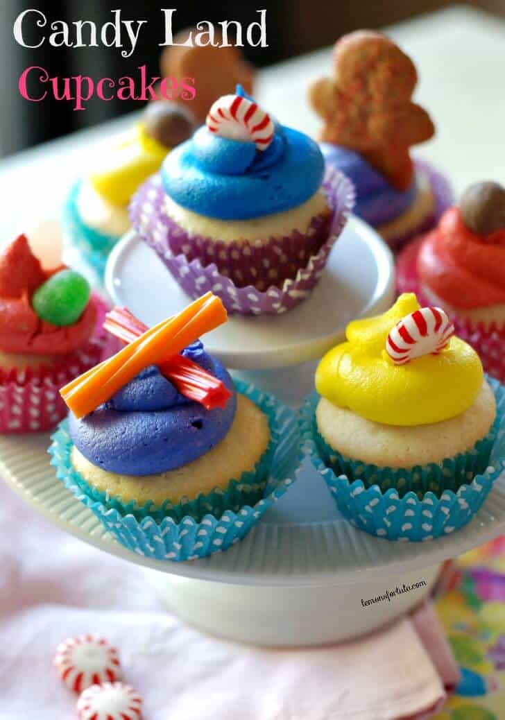 Candy Land cupcakes are topped with sugar and spice on a cake platter. 