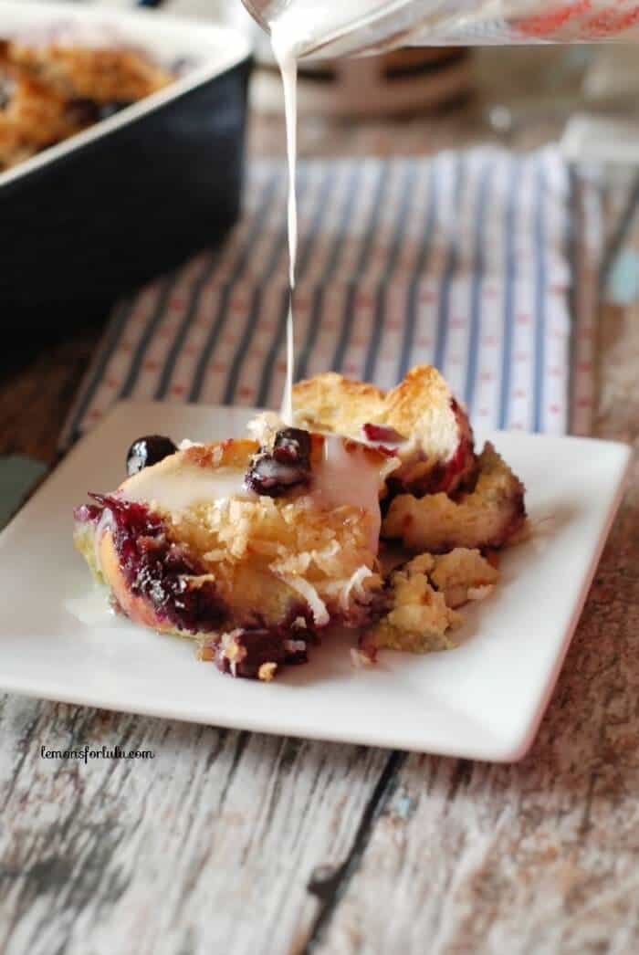 An easy and delicious over night baked french toast that is loaded with plump blueberries and lots of coconut! www.lemonsforlulu.com