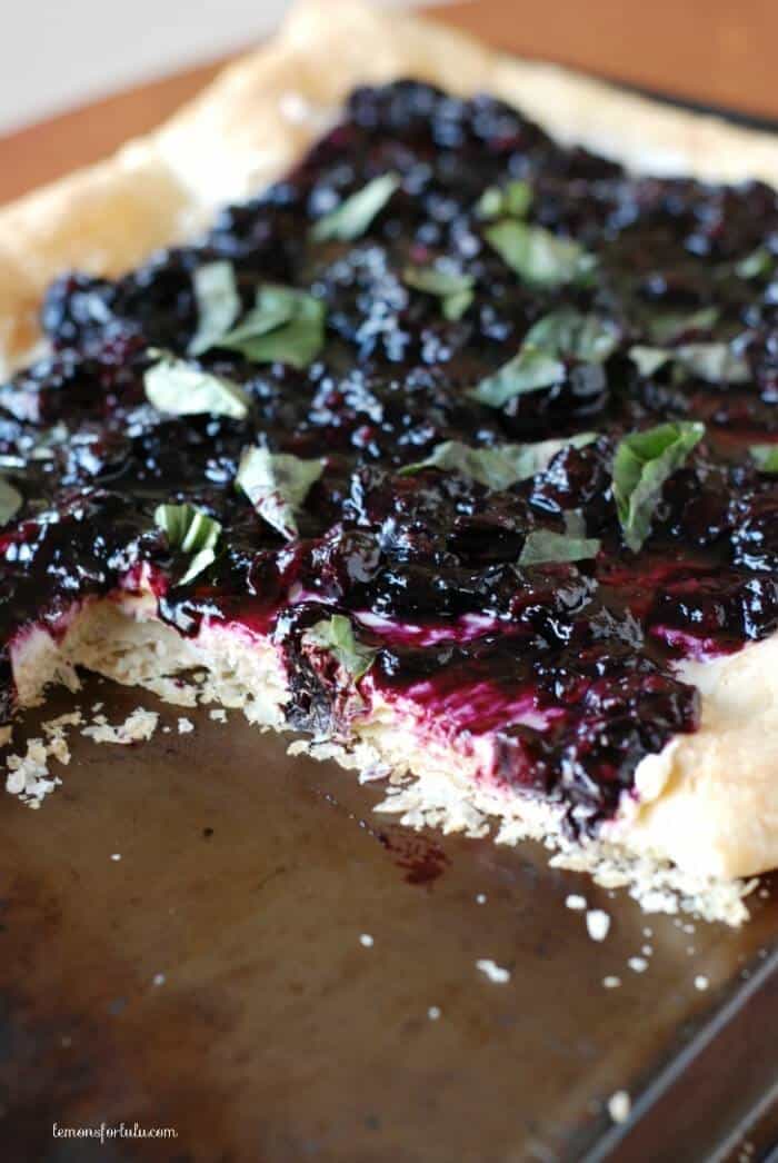 Slow roasted blueberry tart with mascarpone and goat cheese all on a flaky puff pastry crust! www.lemonsforlulu.com