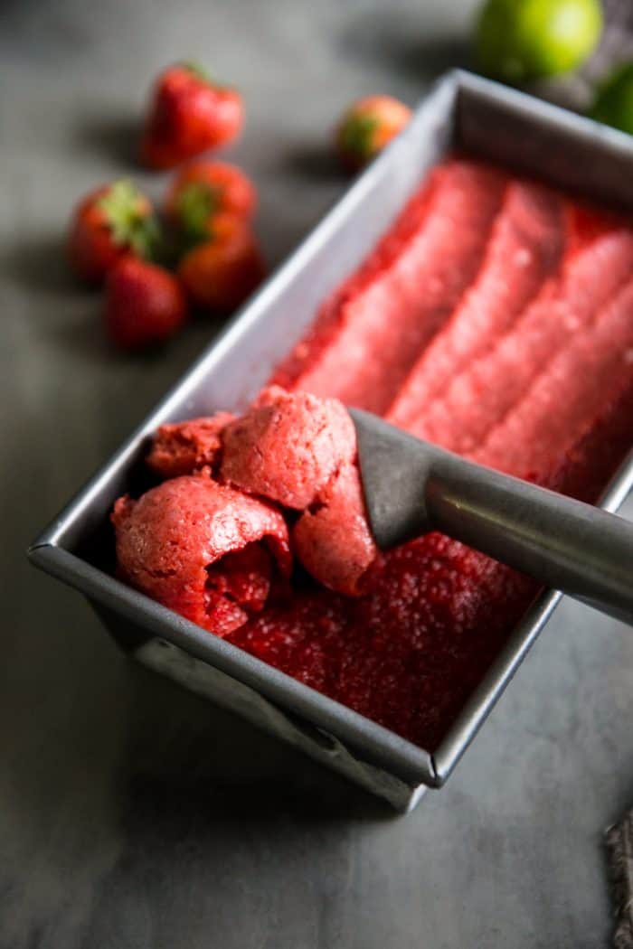 Strawberry sorbet recipe being scooped