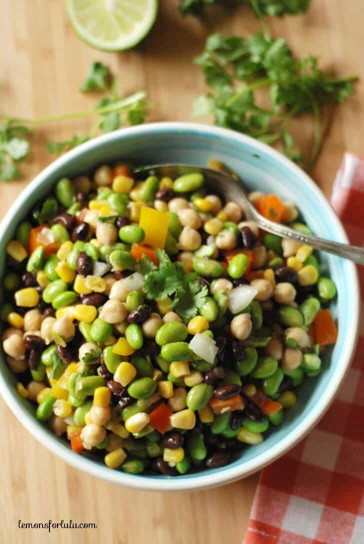 Black beans, corn, garbanzo beans and edamame are tossed with a southwestern flavored vinaigrette! www.lemonsforlulu.com