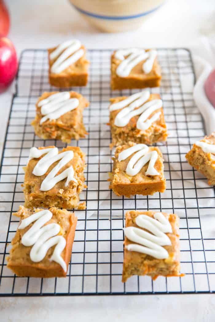 Apple carrot cake bars on a baking rack