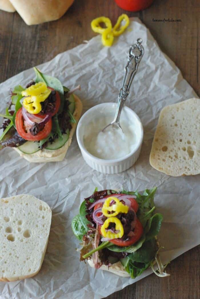 Vegetarian Sandwiches with a Greek flair! Inside you’ll find hummus, veggies, feta and tzitziki sauce! www.lemonsforlulu.com