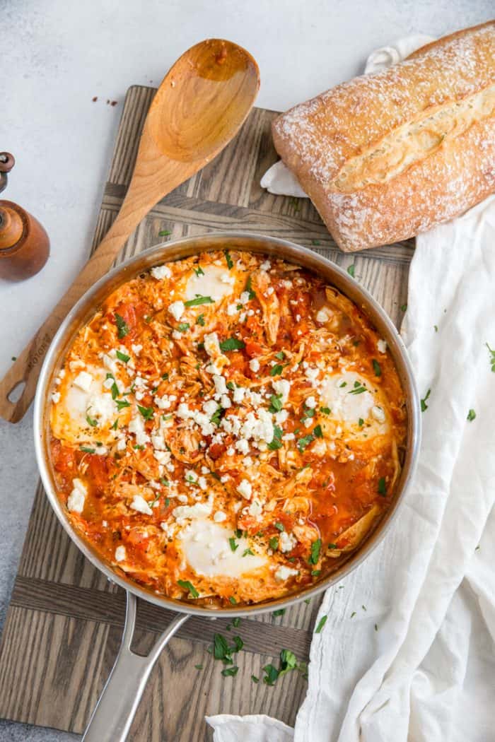 Mediterranean Breakfast Baked Eggs skillet with bread