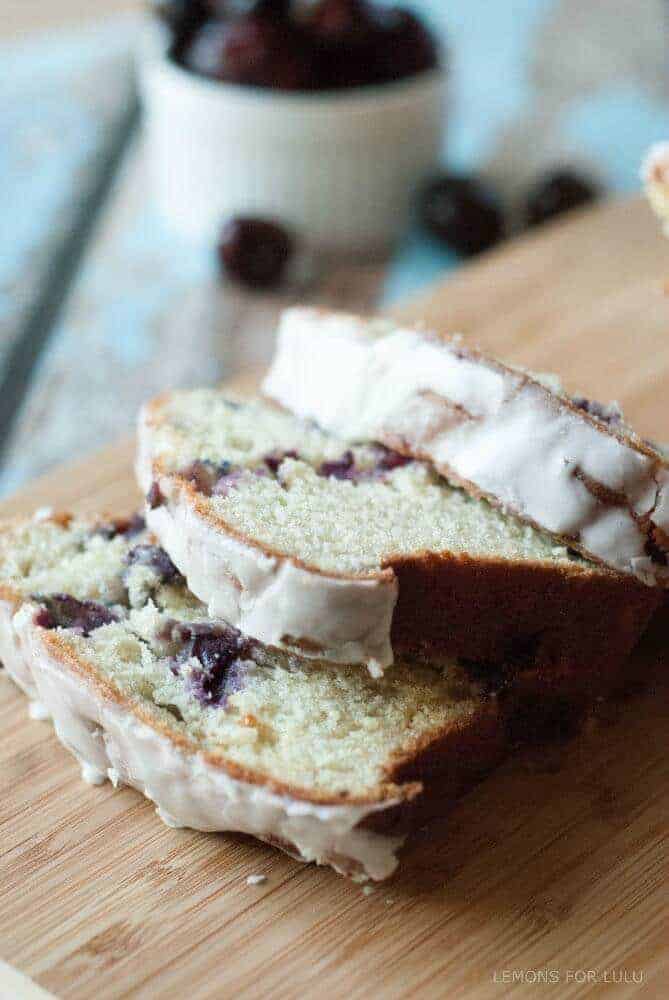 Cherry Almond Quick Bread - Moist, tender quick bread made from fresh cherries, with a hint of almond. A simple almond glaze covers it all! Get the easy quick bread recipe at www.lemonsforlulu.com