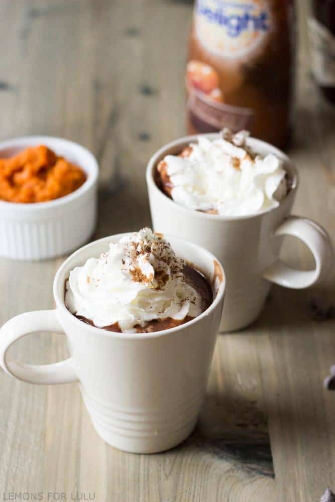 This simple hot chocolate recipe incorporates pumpkin puree, pumpkin spice and chocolate for a rich and cozy treat! www.lemonsforlulu.com #IDelight