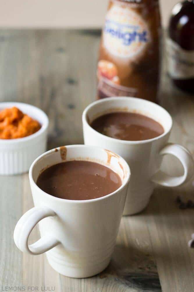 This simple hot chocolate recipe incorporates pumpkin puree, pumpkin spice and chocolate for a rich and cozy treat! www.lemonsforlulu.com #IDelight