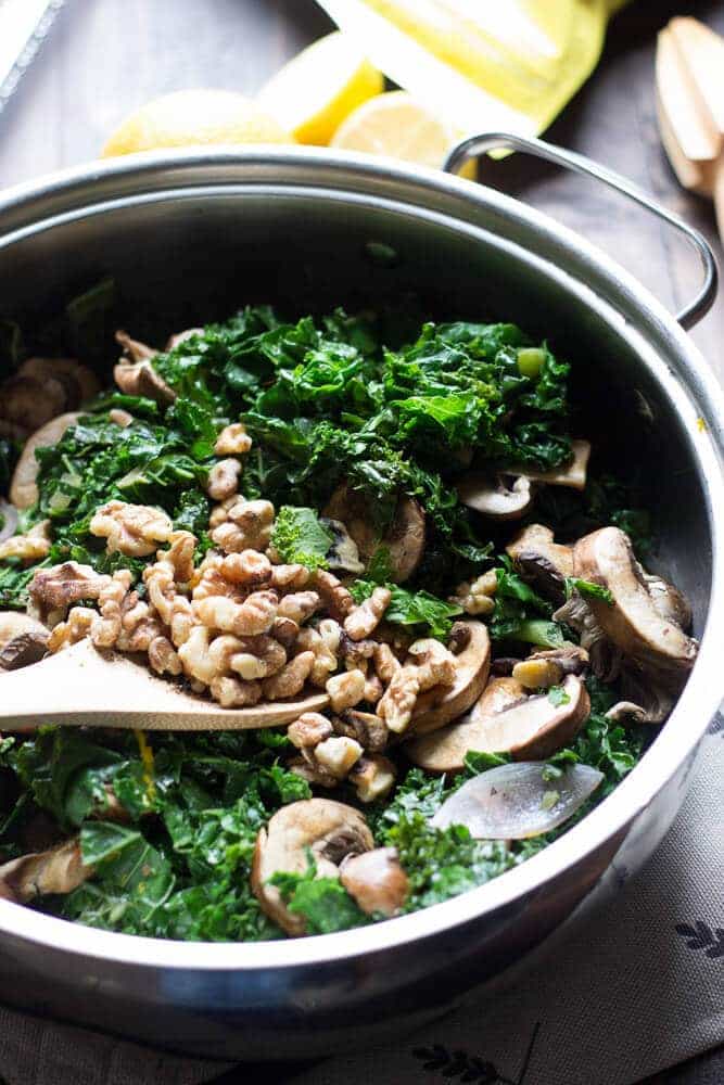This wilted kale salad is packed with goodness, between the baby bella mushrooms, the toasted walnuts and the fresh citrus vinaigrette! Each bite is a powerful mouthful! www.lemonsforlulu.com #SplendaSweeties #SweetSwaps