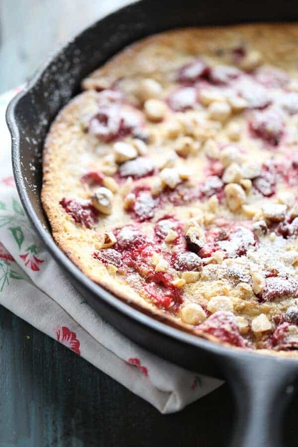 Fresh raspberries and crunchy toasted hazelnuts grace this simple Dutch baby! Enjoy this for breakfast, brunch or dessert! #IDelight #Ad