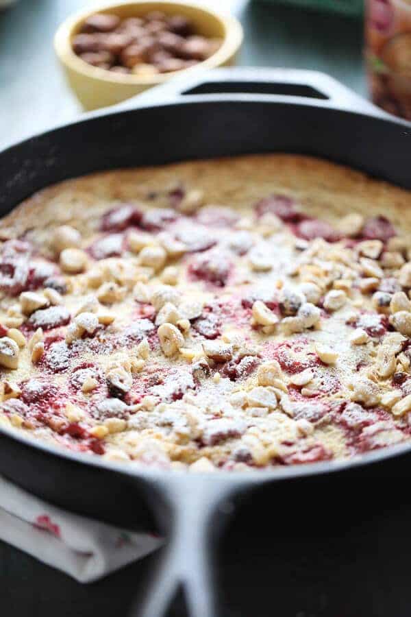 Fresh raspberries and crunchy toasted hazelnuts grace this simple Dutch baby! Enjoy this for breakfast, brunch or dessert! #IDelight #Ad