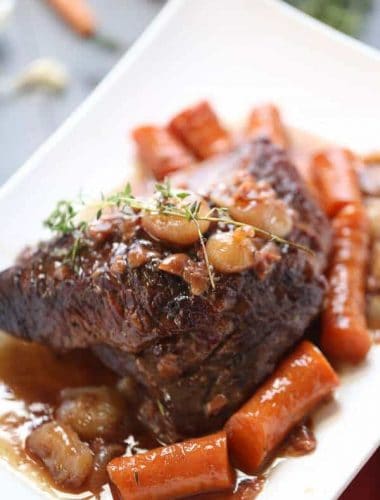 Braised beef brisket is slow cooked with vegetables and a perfect sweet and savory sauce: a perfectl dinner and it couldn’t be simpler! lemonsforlulu.com