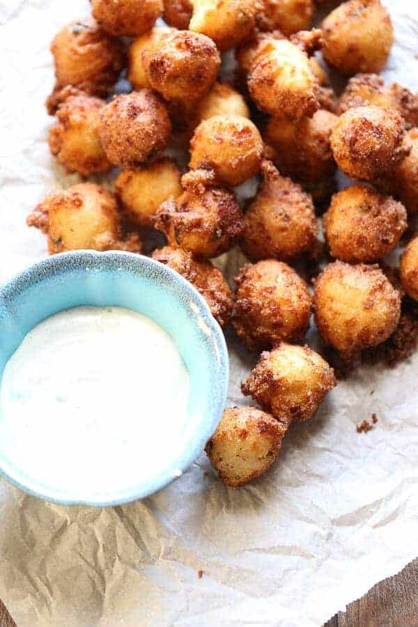 hush puppies piled on parchment paper