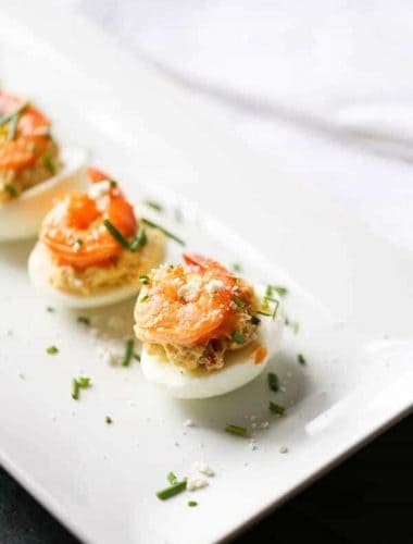 These Buffalo shrimp deviled eggs will be a hit wherever they go! The spicy shrimp are tamed by the tang blue cheese filling. Time to rethink the way you do deviled eggs! #OhioEggRoll