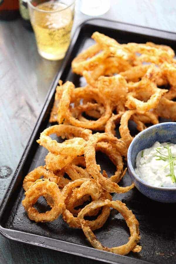 You won’t be able to stop with just one crispy onion ring! The bbq spiced rings are tender on the inside but crunchy on the outside. The blue cheese sauce is the perfect dip! lemonsforlulu.com