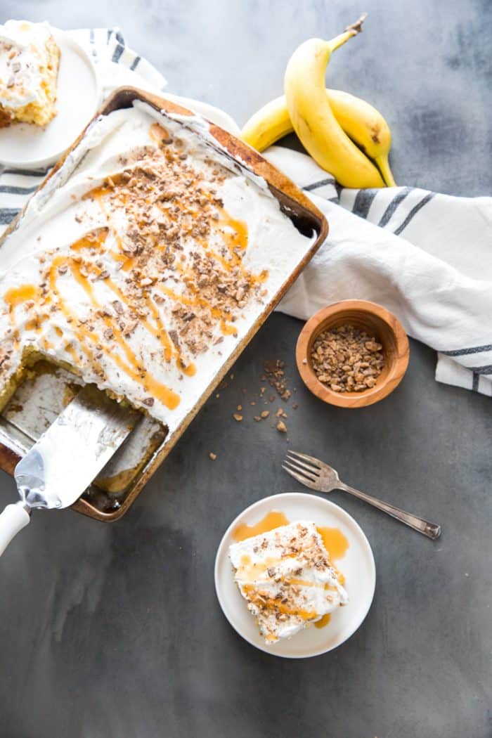 Banana cake in pan with slice on the side