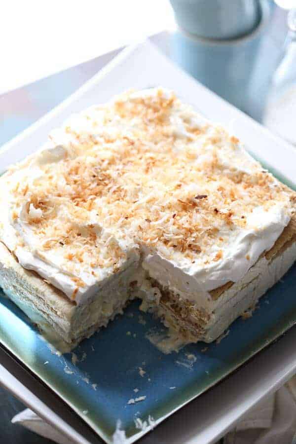 This vanilla coconut ice box cake is light and absolutley dreamy! A no bake treat that tastes purely decadent! lemonsforlulu.com #IDelight @InDelight