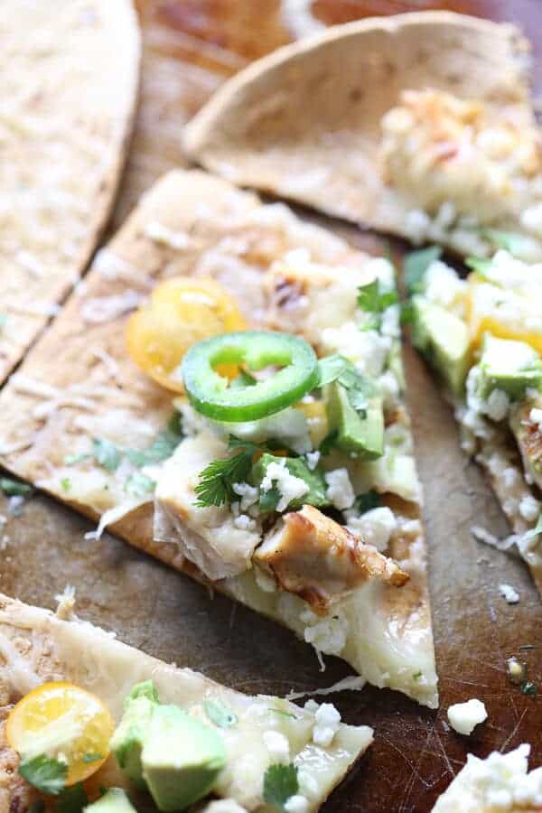 This tequila lime chicken makes a super flavrful topping for flatbread pizza! A quick, easy meal that is perfect for any night of the week! lemonsforlulu.com