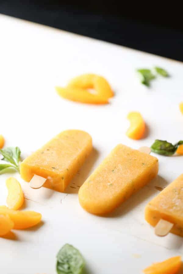 Peaches and basil make the perfect pair in this easy margarita recipe! lemonsforlulu.com
