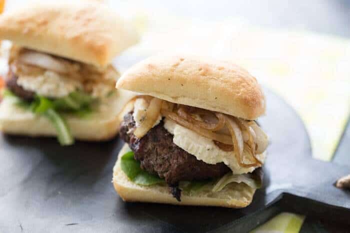 You will be blown away by these cheeseburgers! They start with a beef patty that has been seasoned with fresh herbs. Then they grilled to perfection and topped with a creamy Boursin cheese and flavorful caramelized onions! This cheeseburger recipe is gourmet tasting but easy to prepare! lemonsforlulu.com