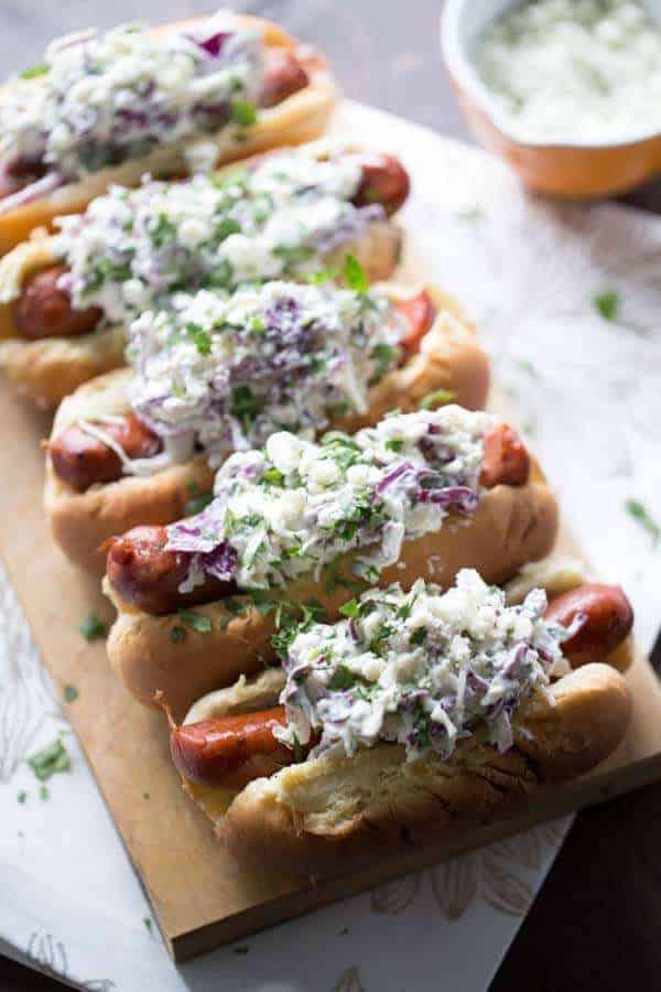 Flavorful andouille sausage is covered in a creamy, cool blue cheese coleslaw! lemonsforlulu.com