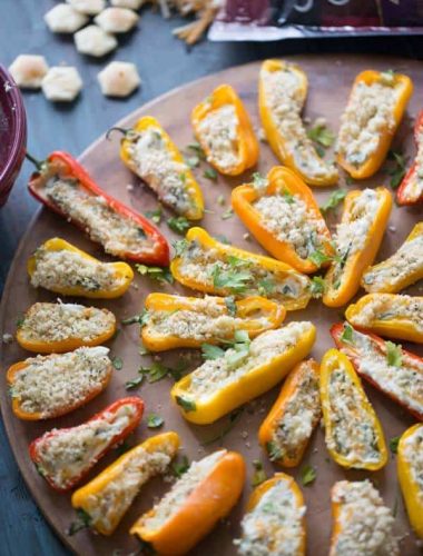 Mini stuffed peppers are grilled just until soft and the two kinds of cheese stuffed inisde begin to bubble! Each pepper is loaded with kale, cheese and bacon! lemonsforlulu.com #ChoppedAtHome