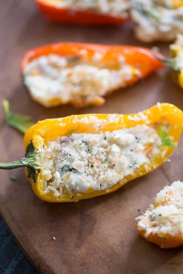 Mini stuffed peppers are grilled just until the two kinds of cheese begin to bubble. Each bite features fresh kale and salty bacon for maximum flavor! lemonsforlulu.com #ChoppedAtHome #ad