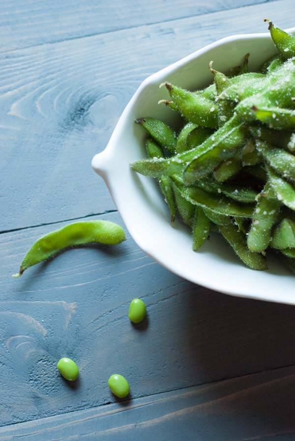 Edamame pods tossed with a little olive oil, garlic and Parmesan cheese. Nature’s finger foods! lemonsforlulu.com