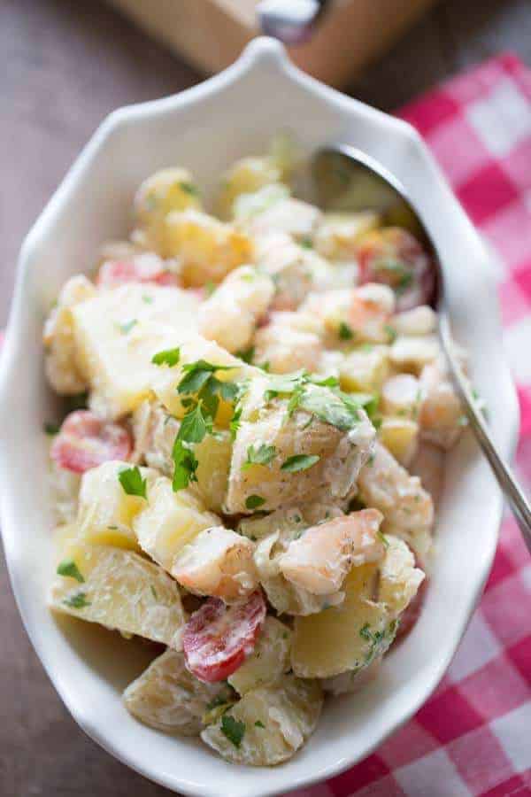 Grilled shrimp and grilled potatoes lend a smokey flavor to this easy Po Boy potato salad recipe! lemonsforlulu.com