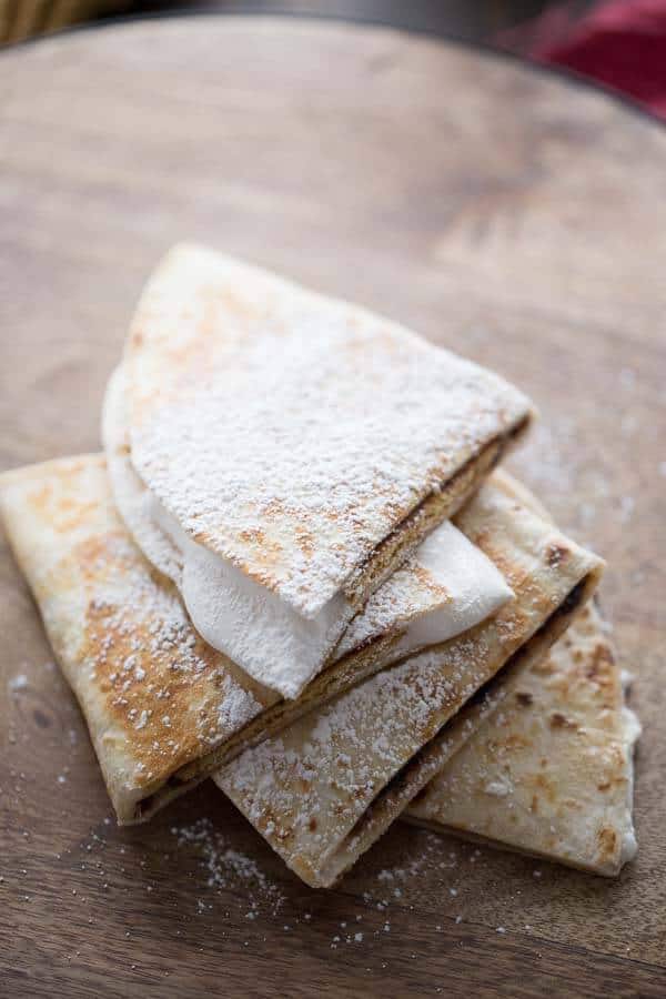 Indoor S’mores with a twist! This quesadilla recipe features all the flavors of a classic S’more tucked inside a tortiilla! lemonsforlulu.com