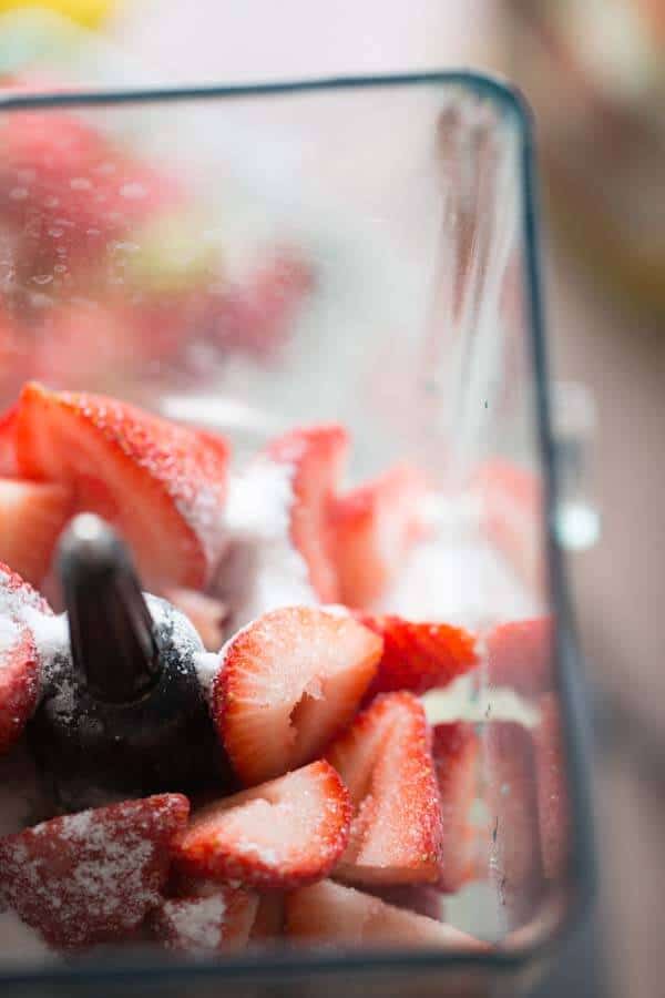 Frozen strawberries in a blender.