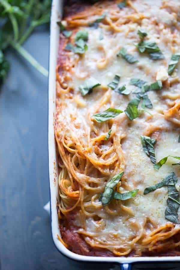 Spaghetti casserole with a cheesy filing, and sauce loaded with veggies! lemonsforlulu.com