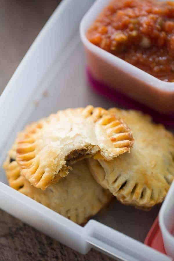 These little meat hand pies taste like tacos with a flakey, buttery crust! lemonsforlulu.com