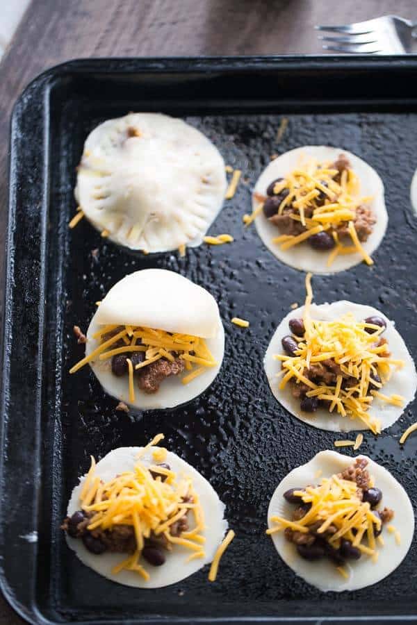 Mini Taco Hand Pies on a baking sheet unbaked