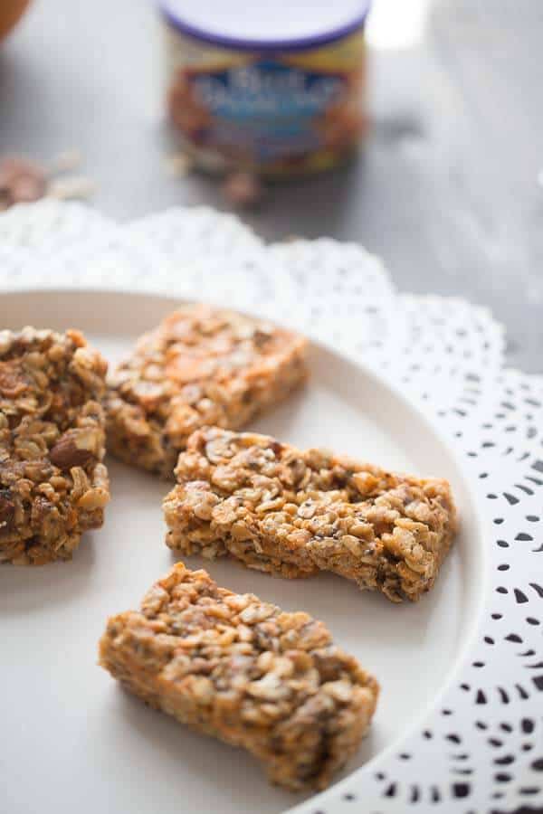 Soft, chewy, homemade granola bars with peanut butter, oats, honey, and salted caramel almonds is easy to prepare and makes an excellent snack when you are on the go! lemonsforlul.com