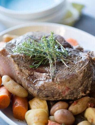 This slow cooker pot roast is going to knock your socks off! Tender beef and simple vegetables are cooked low and slow and are ready when you are! lemonsforlulu.com